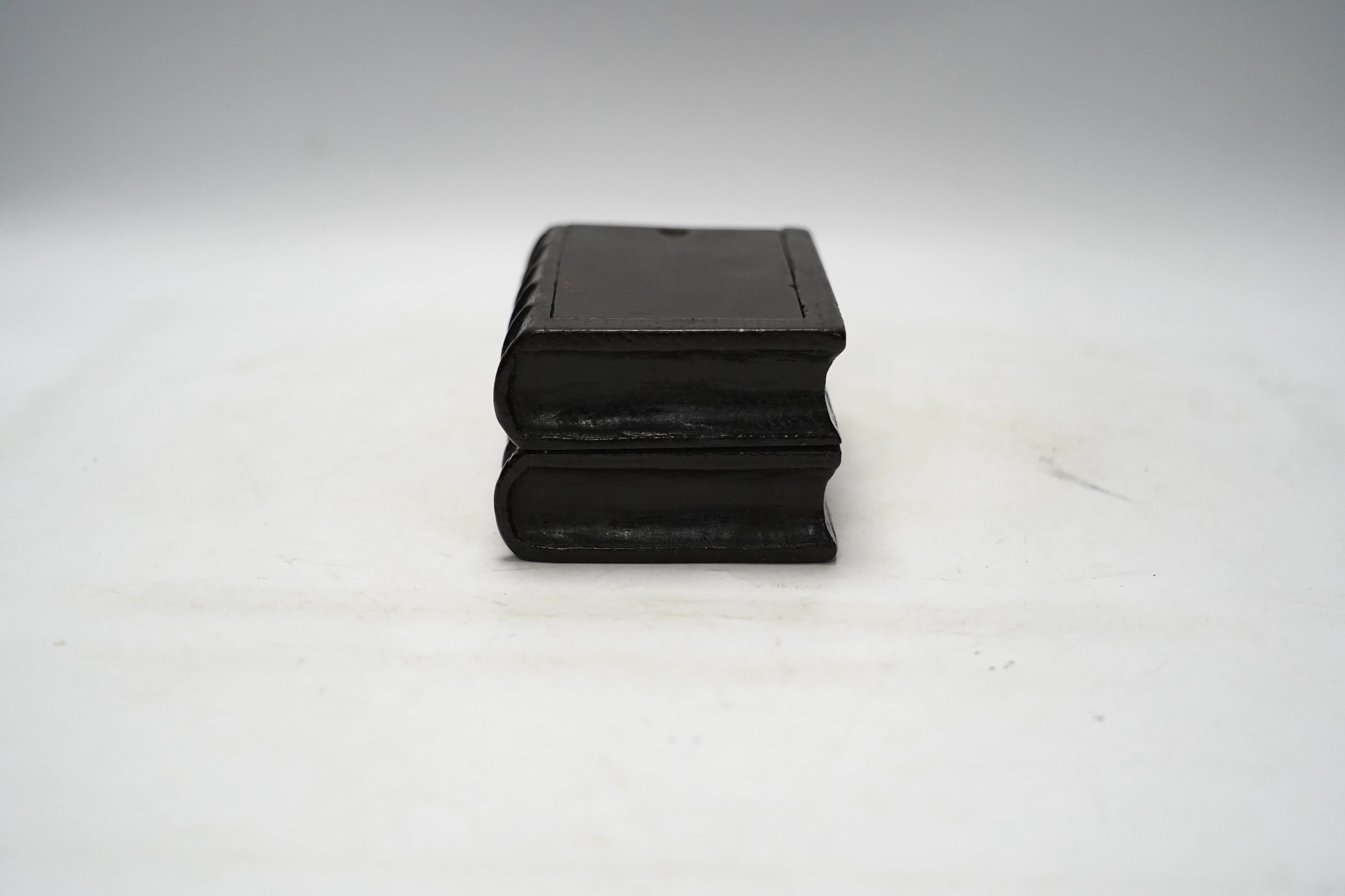 A 19th century novelty treen coin box in the form of two antiquarian books, 15.5cm